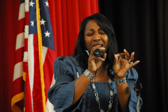 2009 Jacqueline singing at microphone