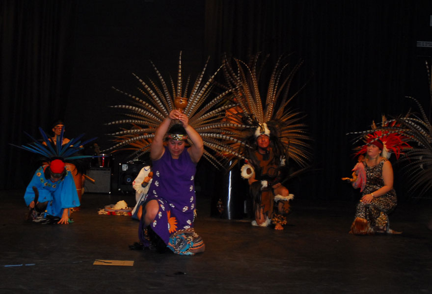 Dancers in costume on stage